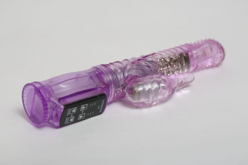 Фиолетовый силиконовый вибратор с подвижной головкой в пупырышках - 21 см. фото 2