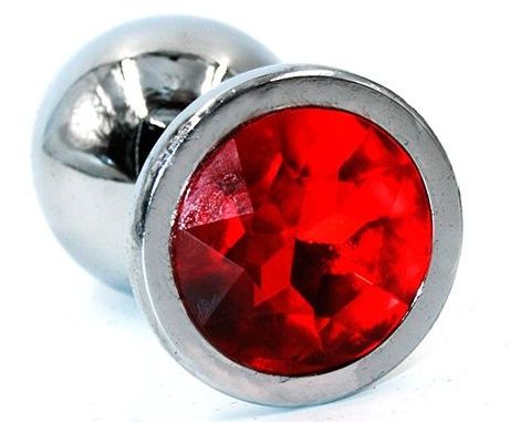 Серебристая анальная пробка среднего размера с красным стразом - 8 см. Серебристая анальная пробка среднего размера с красным стразом - 8 см.