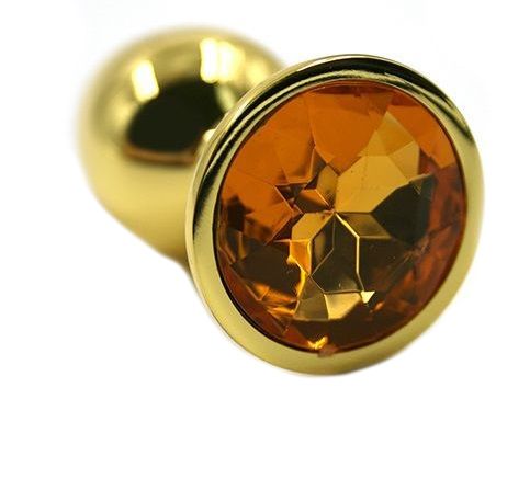 Золотистая алюминиевая анальная пробка с жёлтым кристаллом - 6 см. Золотистая алюминиевая анальная пробка с жёлтым кристаллом - 6 см.