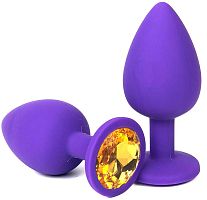 Фиолетовая анальная пробка с оранжевым стразом - 6,8 см.