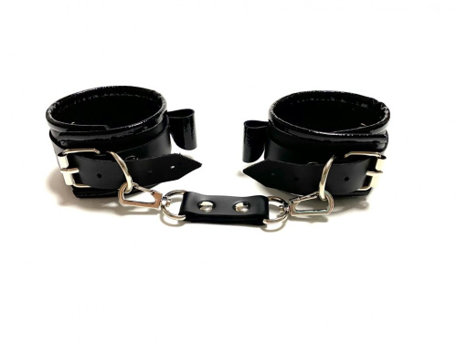 Черные наручники с бантиками из эко-кожи фото 2
